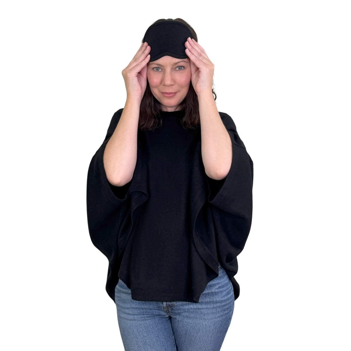 For when the cabin gets cold. A cashmere poncho and eye mask that make settling in a little more comfortable, wherever you're headed.